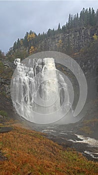 Skjervsfossen waterfall in autumn in the south of Norway