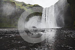 Skogafoss Iceland famous waterfall. Powerful stream, dramatic view with nobody