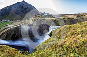 Skogafoss The waterfall is located on the cliffs of the former coast. Reaches a height of 60 m and a width of up to 25 m photo