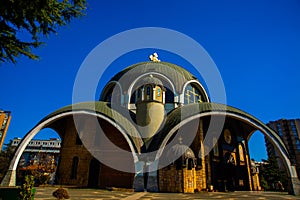 SKOPJE, NORTH MACEDONIA: Beautiful Orthodox Saint Clement of Ohrid Church against the blue sky in the center.