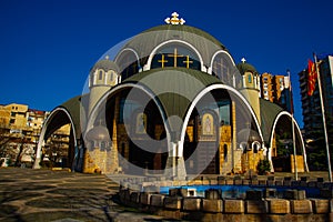 SKOPJE, NORTH MACEDONIA: Beautiful Orthodox Saint Clement of Ohrid Church against the blue sky in the center.