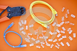 SKS and engineering concept.Set of connectors, ethernet and console cables, crimp tool on the white background.