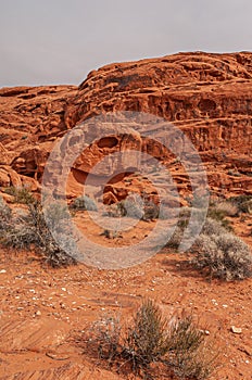 Skull kind of natural holes in red rocks, Valley of Fire, Nevada, USA