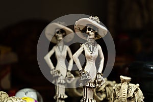 The skulls are displaying their dress on the day of the dead in Mexico.