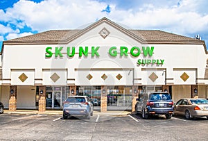 Skunk Grow Supply - Medical Marijuana Dispensary in strip mall with cars parked in front in Tulsa OK