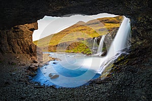 Skutafoss waterfalls near Hofn in Iceland photographed from a cave
