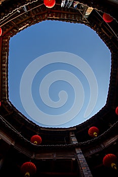 The sky above the round buildings of Hekeng Tulou Cluster in the morning, China