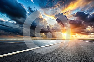 Sky Background Horizon with Dramatic Clouds and Empty Dark Asphalt Street Floor photo