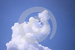 Sky background with white clouds resembling an elephant's trunk, clouds resembling an elephant-shaped animal