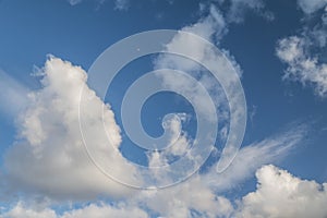 Sky background with white cumulus clouds