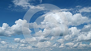 Sky with bautiful silky clouds. Puffy fluffy cumulus and cirrocumulus clouds. Timelapse. photo