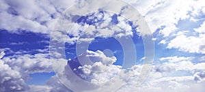 The sky beyond the clouds was a bright blue.