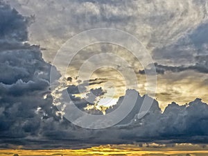 Sky with Big Clouds and the Sun Behind