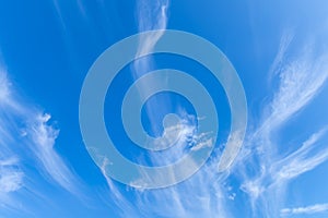 The sky is blue with clouds in beautiful, strangely patterned lines