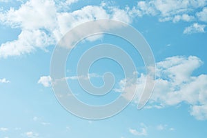 Sky. Blue sky with white clouds background. Curly clouds on a sunny summer day. Light cloudy. Good weather. Simple background sky