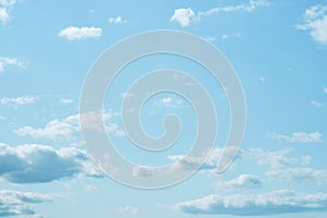 Sky. Blue sky with white clouds background. Curly clouds on a sunny summer day. Light cloudy. Good weather. Simple background sky
