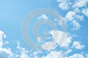 Sky. Blue sky with white clouds background. Curly clouds on a sunny summer day. Light cloudy. Good weather. Simple background sky