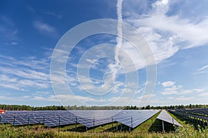 Sky with cirrus clouds over ground-mounted solar power station