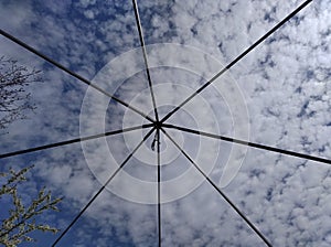 sky with clouds behind bars, lattices photo
