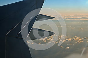 Sky and clouds at dusk from aircraft window