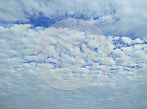 Sky with clouds. Meteorology, climate.Sky with clouds.White, fluffy clouds in blue sky.Sun rays and clouds.