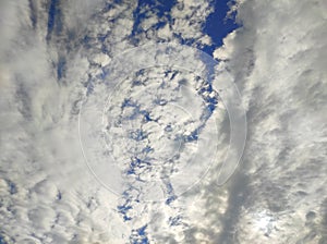 Sky with clouds. Meteorology, climate.Sky with clouds.White, fluffy clouds in blue sky.Sun rays and clouds.