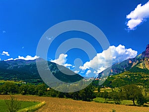 Sky, clouds, mountains and fields