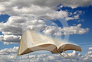 Sky clouds and open bible