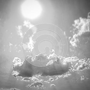 Sky with clouds and sun in black and white