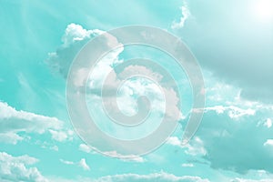 Sky.Clouds and sunshine. White clouds and sun rays in a blue sky.Beautiful heavenly wallpaper in blue tones.sky is in