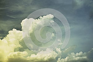 Sky with clouds vintage retro background. Sepia tone. Yellow golden sunset. Sun light. Dramatic cloudy. Wind storm rain