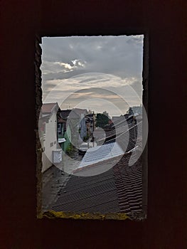 the sky is cloudy behind the window after the rain