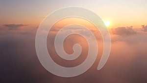 The sky is cloudy and the sun is setting