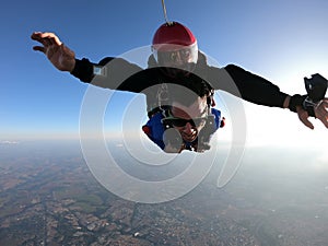 Sky dive tandem friends at the sunset