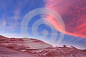 The sky divides beautifully over stone formations in moon valley, Atacama desert, Chile