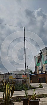 sky and electricity poles in the corners of the city