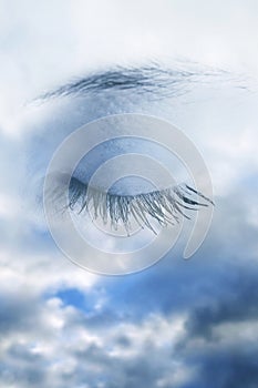 Sky with eye of a sleeping or dreaming girl