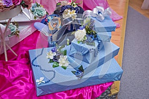 Sky gift boxs . Sky gift boxes on white flowers and sky beads . Christmas and New Year`s Day ,open blue gift box top view selecti