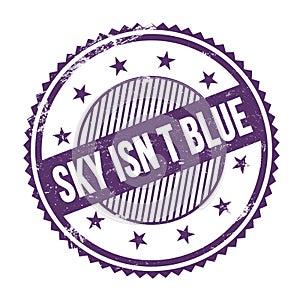 SKY ISN T BLUE text written on purple indigo grungy round stamp