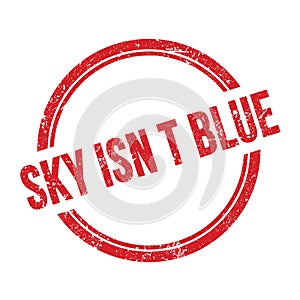 SKY ISN T BLUE text written on red grungy round stamp