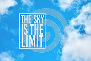 The sky is the limit motivational or inspirational quote against blue sky with clouds photo