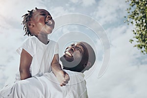 The sky is the limit. Shot of a young father and daughter spending time together outside.