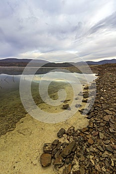 Sky reflected in the water of Ticha Dam