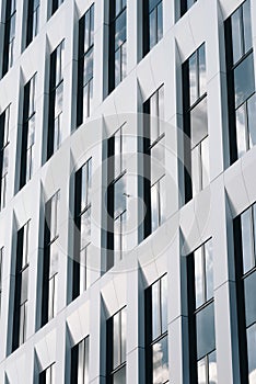 Sky reflecting on white office facade