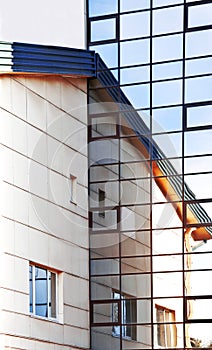 Sky reflections in the glass wall.