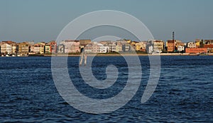 Between sky and sea a line of houses in the province of Venice Pellestrina