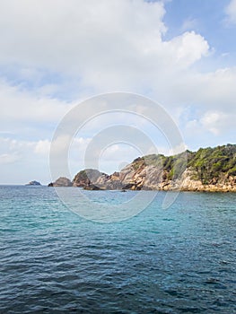 Sky and sea with rocky island