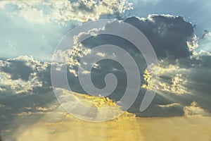 Sky with storm clouds and sunshine breaking through in rays -r eplacement or background