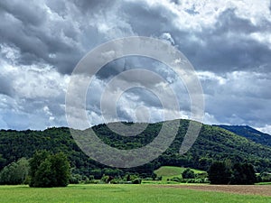 Sky before storm - gray clouds over Pohorje Mountains. Green Slovenia