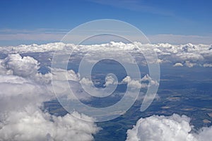 Sky with stormy white clouds over Ukraine view from the airplane window
